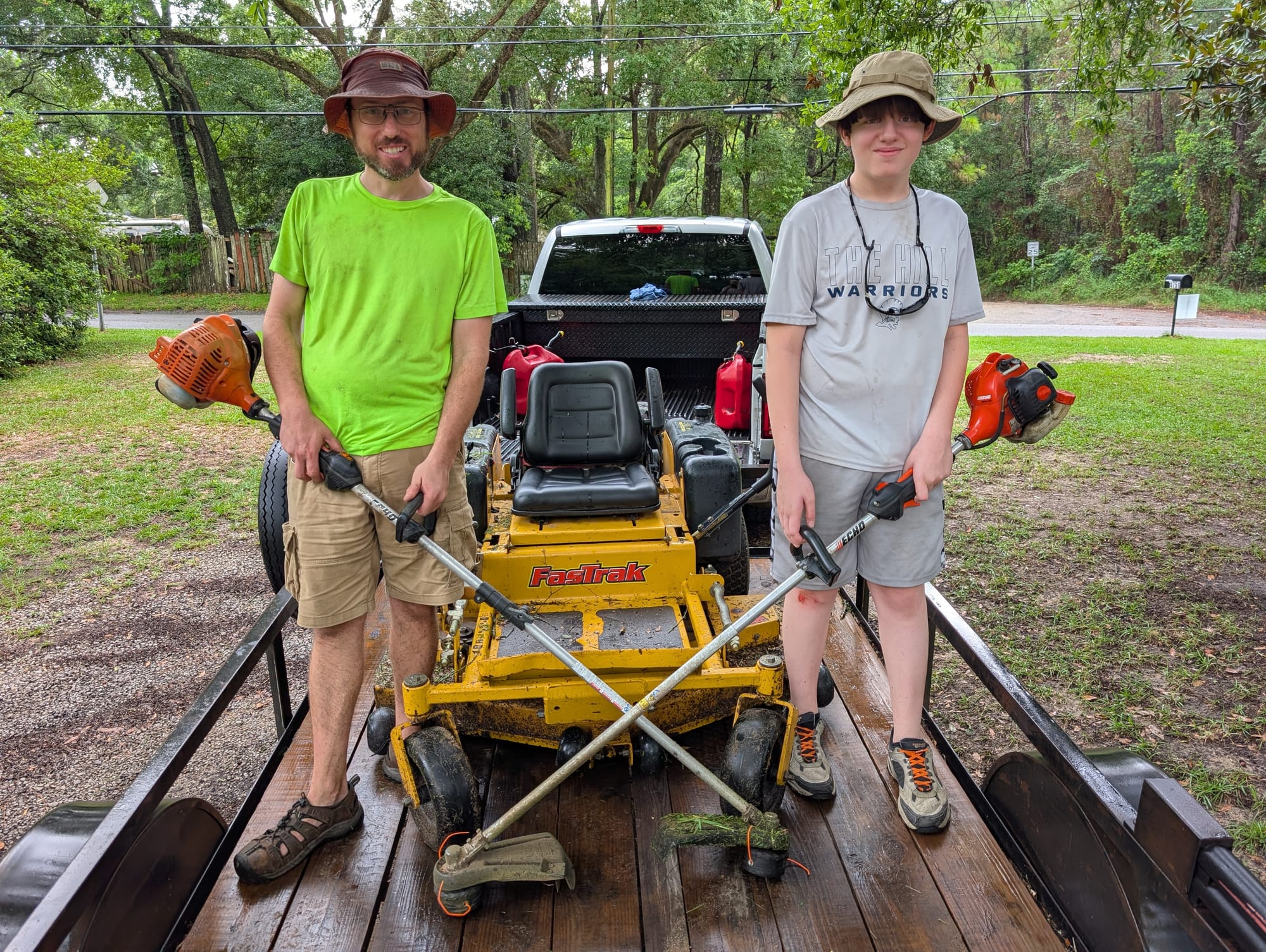 Freeland Lawn Care crew with FasTrak zero-turn mower and trimmers